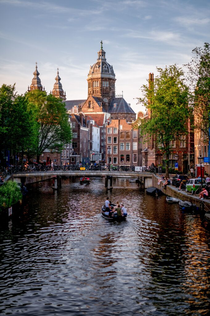 Central Station and the canals in Amsterdam city in the Netherlands.